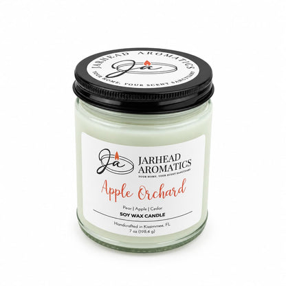 A Jarhead Aromatics Apple Orchard Soy Wax Candle | Pear, Apple & Cedar in a jar with a black lid.