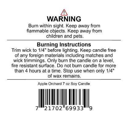 A warning label on a Jarhead Aromatics Apple Orchard Soy Wax Candle | Pear, Apple & Cedar, including burning instructions, safety precautions, product weight, and a barcode.