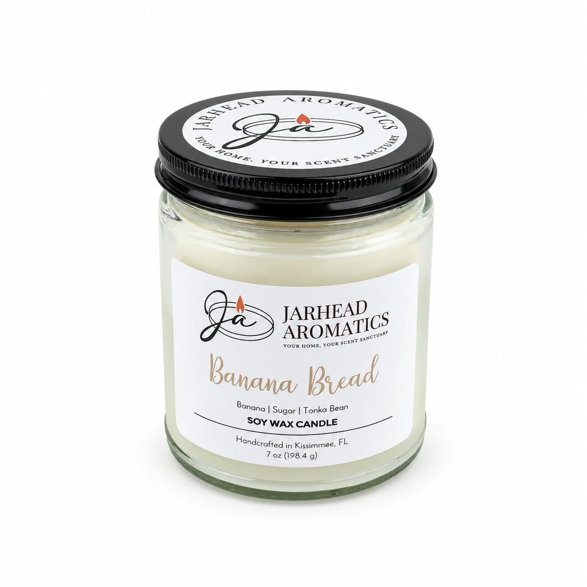A Banana Bread Soy Wax Candle | Banana, Sugar & Tonka Bean in a glass jar with a black lid.
