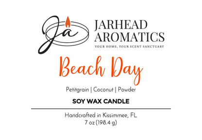 Label for Jarhead Aromatics’ Beach Day Soy Wax Candle | Coconut, Citrus & Coastal Breeze Candle—crafted in Kissimmee, FL, and infused with a refreshing coastal fragrance featuring petitgrain, coconut, and powder notes. Enjoy a long-lasting scent with black and orange text on a clean white background.