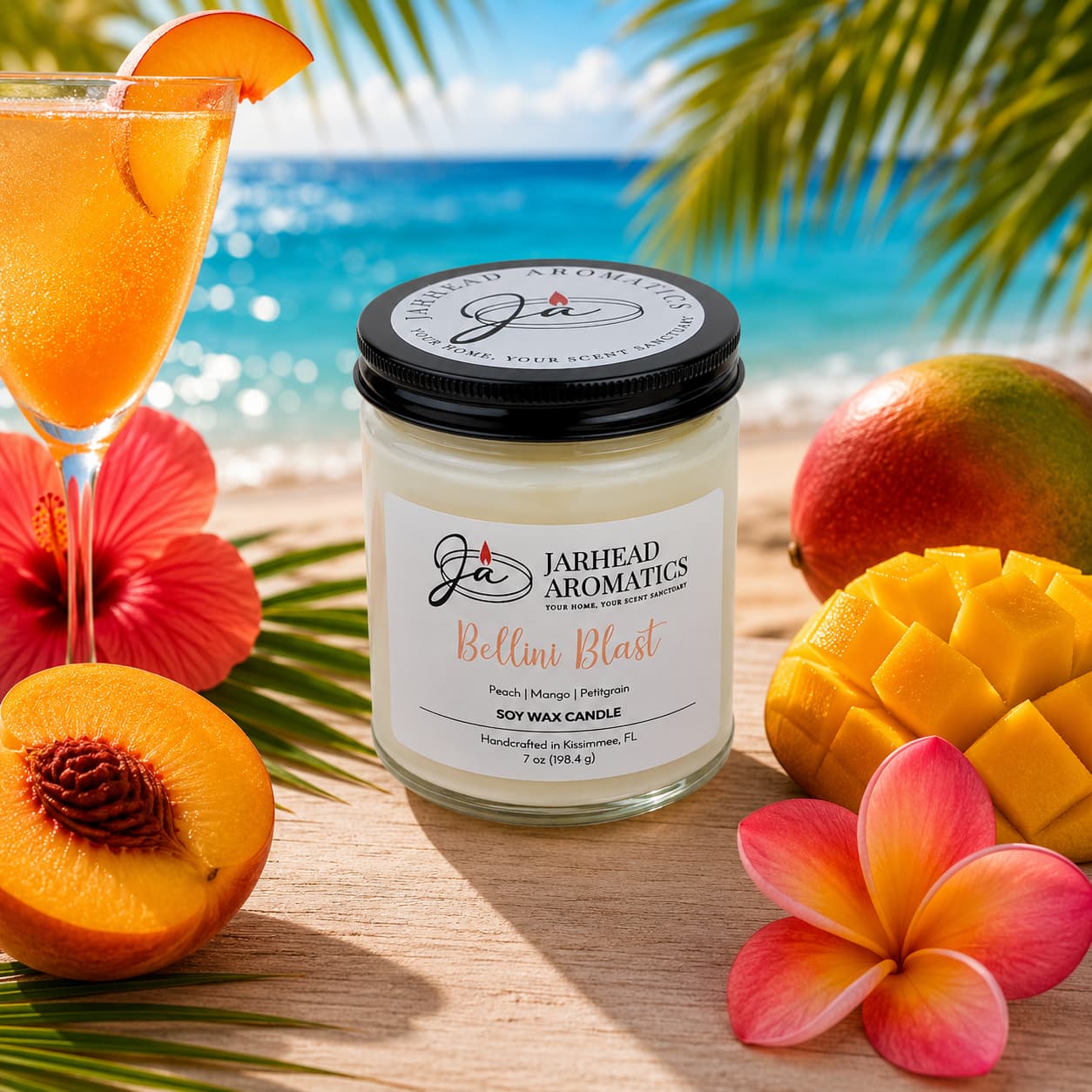 The Bellini Blast Soy Wax Candle by Jarhead Aromatics, featuring peach, mango, and tangerine scents, is showcased on a tropical table with sliced fruit and plumeria flowers against an ocean and palm leaf backdrop.