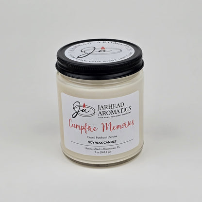 Experience the cozy fragrance of fall with the Jarhead Aromatics Campfire Memories Soy Wax Candle, featuring smoky embers, maple, moss, and patchouli. Handcrafted in Kismet, FL, this candle is hand-poured in a clear glass jar with a black lid—perfect for creating warm autumn memories.