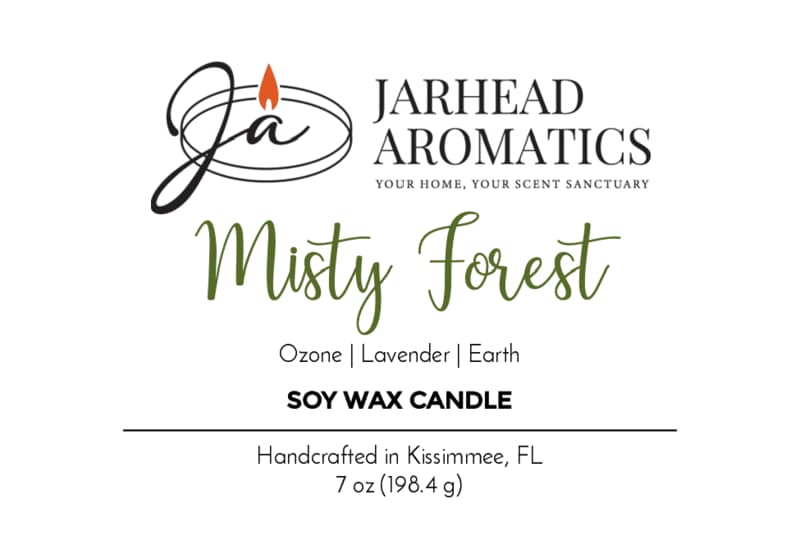 Jarhead Aromatics Misty Forest Soy Wax Candle label. This natural soy wax candle blends earthy moss, lavender, and juniper for an immersive forest-inspired aroma. Handcrafted in Kissimmee, FL. Black and green text with a flame graphic. 7 oz (198.4 g).