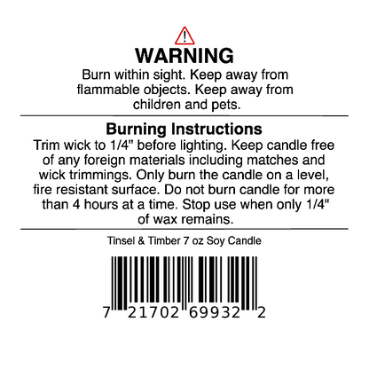 Jarhead Aromatics Tinsel & Timber Soy Wax Candle | Eucalyptus, Pine, Smoke & Tonka Holiday Candle – 7 oz candle warning label featuring safety instructions, burning guidelines (like trimming the wick and not burning your soy wax candle for more than 4 hours), and a barcode. Perfect for all your holiday fragrance needs.