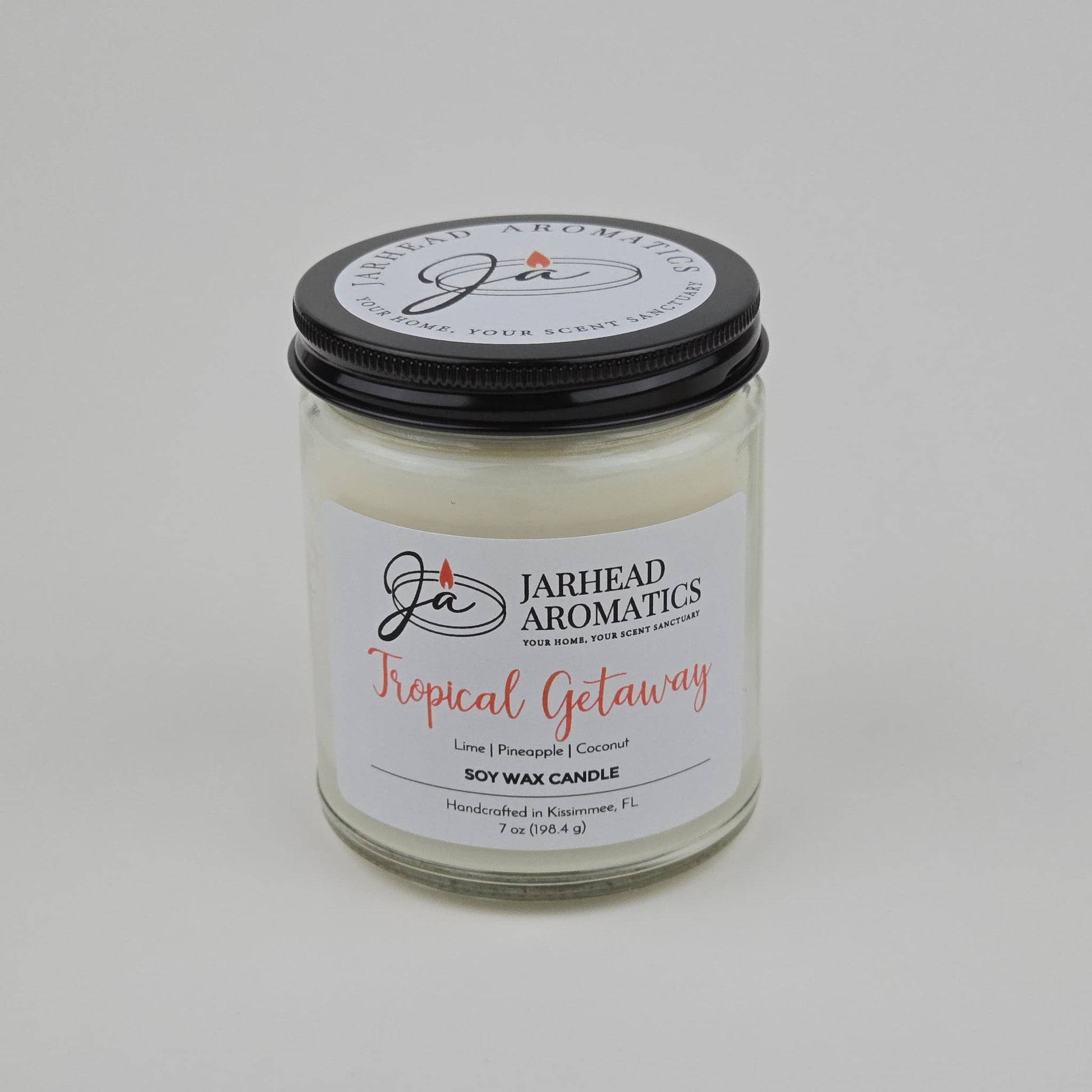 The Jarhead Aromatics Tropical Getaway Soy Wax Candle features mango, coconut, and pineapple scents in a 7 oz handcrafted candle made in Kissimmee, FL—ideal for an authentic tropical fragrance experience.