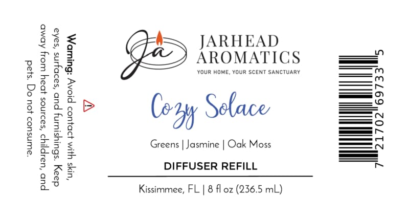 Jarhead Aromatics Cozy Solace Diffuser Refill | Fresh Greens, Jasmine, Oak Moss label featuring product details, ingredients (Fresh Greens, Jasmine, Oak Moss), barcode, and a warning to avoid contact. This autumn home fragrance offers a comforting touch for your space. Proudly crafted in Kissimmee, FL—perfect for use with your favorite home fragrance diffuser.