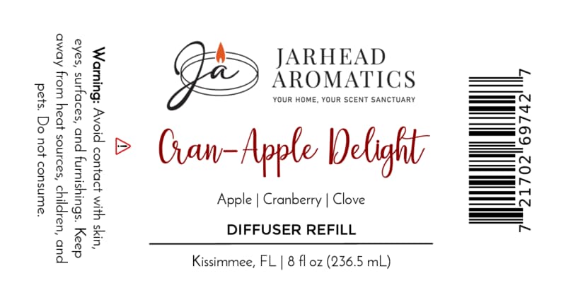 Label for Jarhead Aromatics Cran-Apple Delight Diffuser Refill | Cranberry, Apple & Warm Cinnamon, featuring a cozy autumn blend of cranberry, apple, and warm cinnamon fragrances. Perfect addition to your home fragrance collection. Includes usage warning, barcode, and 8 fl oz size. Company based in Kissimmee, FL.