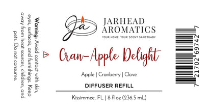 Label for Jarhead Aromatics Cran-Apple Delight Diffuser Refill | Cranberry, Apple & Warm Cinnamon, featuring a cozy autumn blend of cranberry, apple, and warm cinnamon fragrances. Perfect addition to your home fragrance collection. Includes usage warning, barcode, and 8 fl oz size. Company based in Kissimmee, FL.