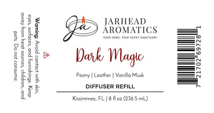 A Jarhead Aromatics Dark Magic Diffuser Refill label for a home fragrance blend featuring peach, plum, dark florals, and vanilla musk. This 8 fl oz (236.5 mL) refill includes warning text and a barcode.
