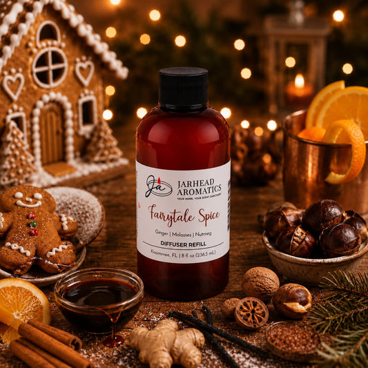 A bottle of Jarhead Aromatics Fairytale Spice Diffuser Refill | Gingerbread, Molasses & Warm Spice rests on a table adorned with gingerbread cookies, oranges, spices, nuts, syrup, and a gingerbread house—filling the scene with the comforting aroma of holiday baking and evoking the cozy warmth of a classic gingerbread home fragrance for a festive holiday atmosphere.