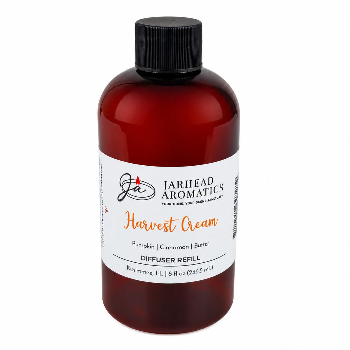 A brown bottle labeled Jarhead Aromatics Harvest Cream Diffuser Refill in the scent Pumpkin Spice, Brown Sugar & Vanilla Cream—this creamy pumpkin fragrance creates the perfect autumn atmosphere for your home. The bottle features a black cap and contains 8 fl oz (236.5 mL).