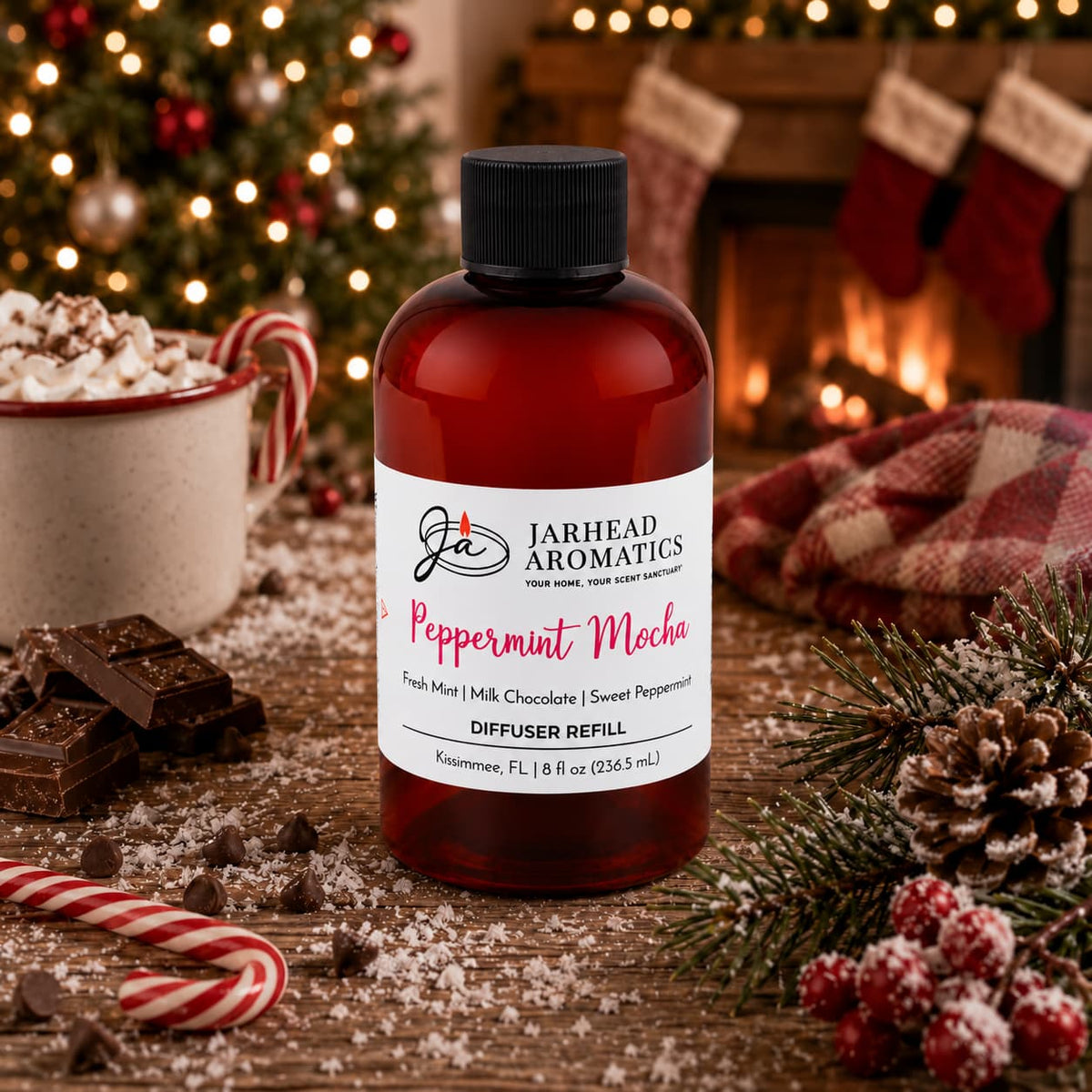 Amber bottle of Peppermint Mocha Diffuser Refill by Jarhead Aromatics on a wooden table, surrounded by chocolate, candy canes, and festive holiday decor.