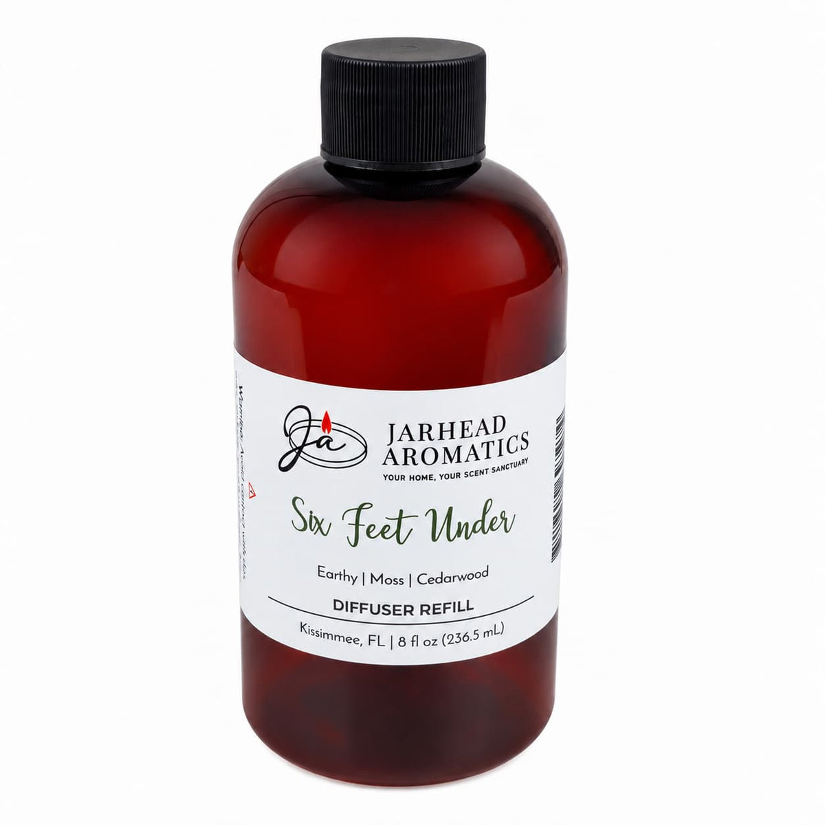 The Jarhead Aromatics Six Feet Under Diffuser Refill comes in a brown plastic bottle with a black cap and is photographed against a white background. This 8 fl oz refill features an earthy home scent with notes of damp earth, moss, and ancient oak—perfect for those who love rich, grounding fragrances.