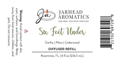 Label for Jarhead Aromatics Six Feet Under Diffuser Refill | Damp Earth, Moss & Ancient Oak, highlighting an earthy home scent with moss and the signature Graveyard fragrance. Warning: avoid contact and consumption. For questions, contact us in Kissimmee, FL.