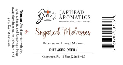 A white Jarhead Aromatics label for the Sugared Molasses Diffuser Refill | Buttercream, Honey & Dark Molasses, featuring a cozy blend of buttercream, honey, and dark molasses. This autumn home fragrance includes warning text, a barcode, and an 8 fl oz size from Kissimmee, FL.