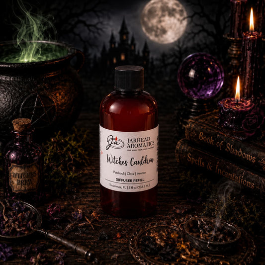 A bottle of Jarhead Aromatics’ Witches Cauldron Diffuser Refill | Orange Blossom, Patchouli & Dark Incense rests among spell books, candles, and mystical items, with a cauldron, full moon, and swirling green mist in the background—creating a magical Halloween scene filled with an enchanting fragrance blend that’s perfect for any home fragrance lover.
