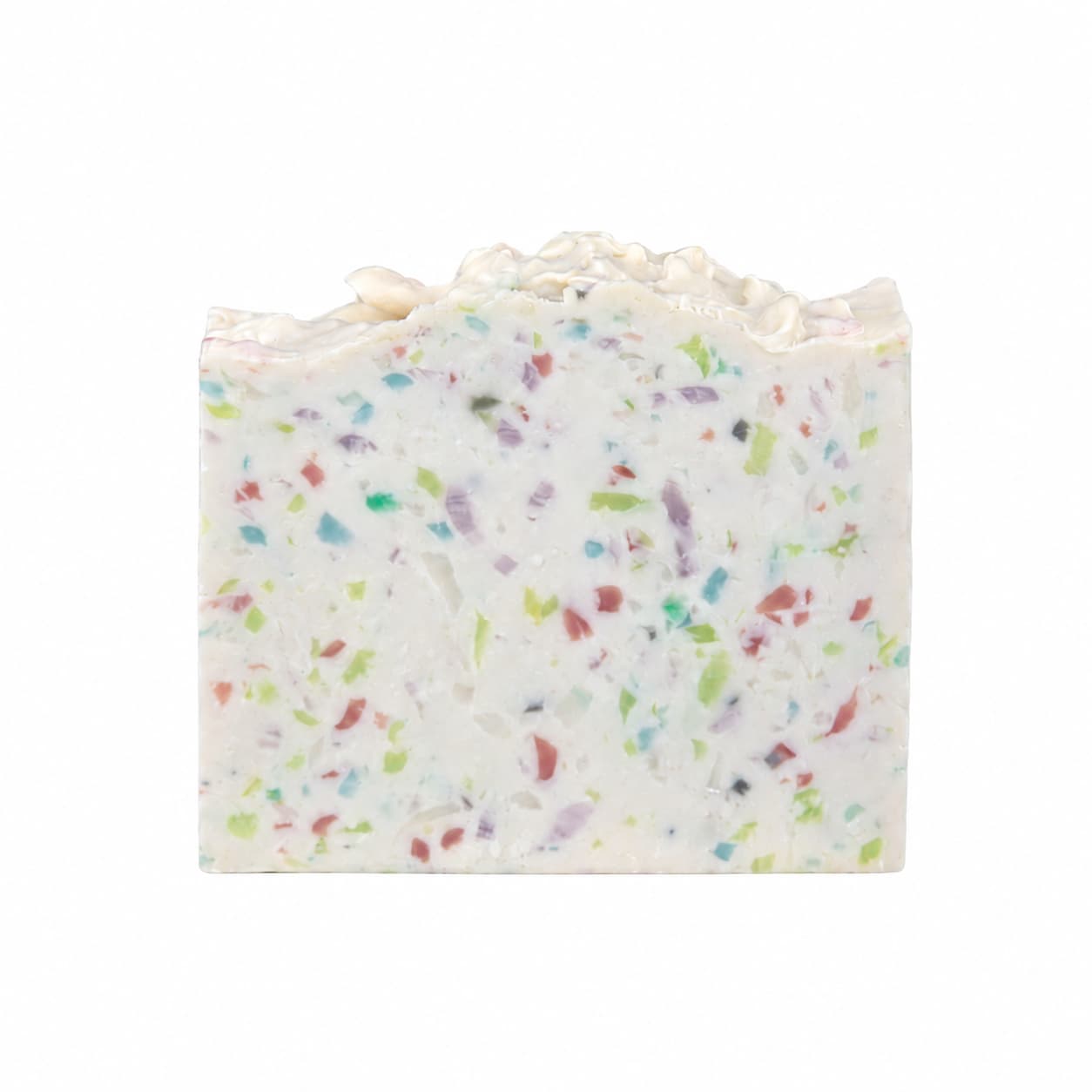A rectangular bar of Almond + Berry Handmade Coconut Milk Artisan Soap by Jarhead Aromatics, featuring colorful specks in green, red, blue, and purple and a textured top edge, set against a plain white background.