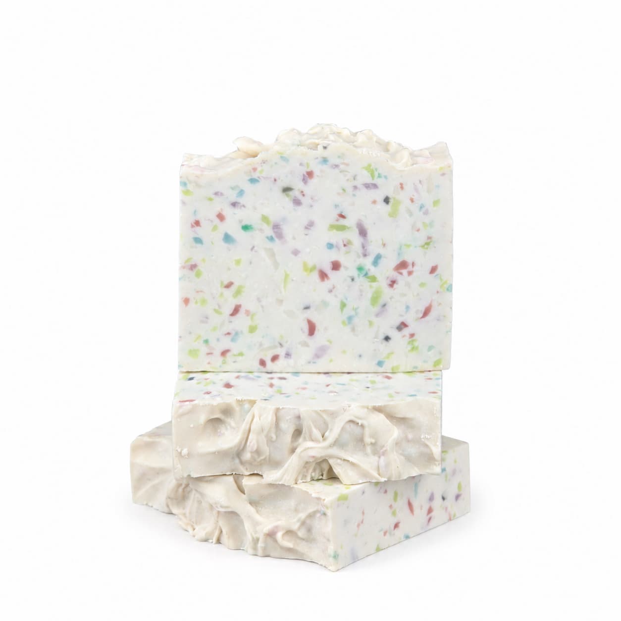 Two rectangular bars of Jarhead Aromatics Almond + Berry Handmade Coconut Milk Artisan Soap, featuring colorful speckles and textured, wavy tops, are stacked on a white background.