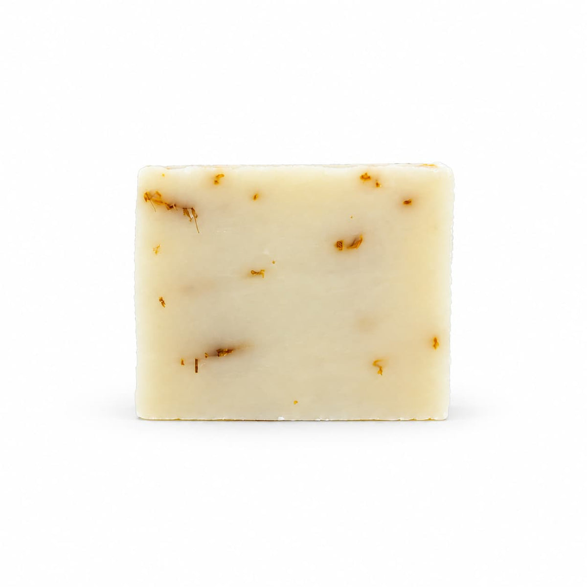 Rectangular bar of off-white Aloe + Calendula Natural Handmade Soap embedded with dried flower petals.
