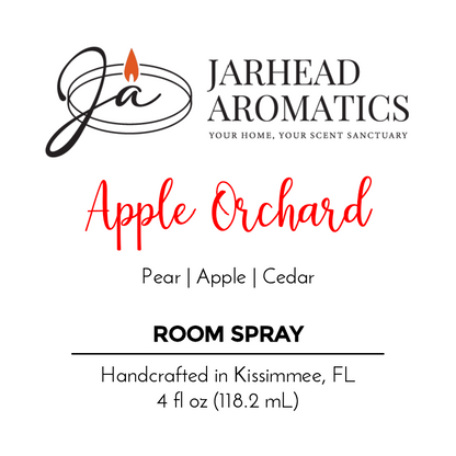 A product label for Jarhead Aromatics Apple Orchard Room Spray features pear, fresh apples, and cedar fragrance notes. It is handcrafted in Kissimmee, FL, with a 4 fl oz (118.2 mL) volume and includes the logo and tagline.
