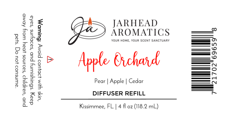 A label for Jarhead Aromatics Apple Orchard Diffuser Refill | Fresh Apple, Pear & Cedar Home Fragrance Oil Refill. Features apple, pear, and cedar scent. Warns to avoid skin/eye contact. Barcode right side. 4 fl oz (118.2 mL).