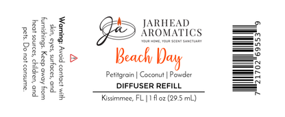 Label for “Beach Day Car Diffuser Refill | Coconut Citrus & Coastal Car Air Freshener” by Jarhead Aromatics. Features tropical notes of petitgrain, coconut & powder. Long-lasting scent. Avoid skin/eye contact. Barcode right side.
