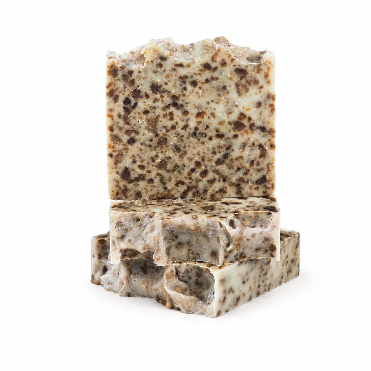 Three bars of Jarhead Aromatics’ Black Soap + Lavender Handmade Natural Artisan Soap, featuring a creamy white base with a brown, speckled texture, stacked against a white background.