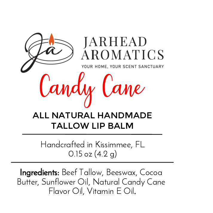 A label for Jarhead Aromatics Tallow Lip Balm - All Natural - Assorted Flavors, crafted in Kissimmee, FL with grass-fed beef tallow. Logo shows a candle flame and stylized JA initials, reflecting pure ingredients.