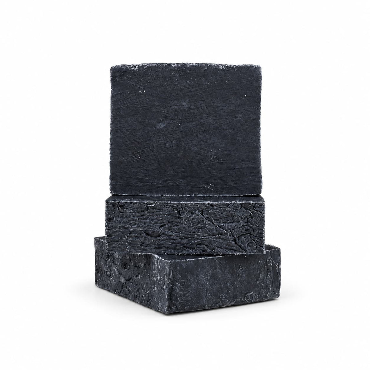 A stack of three rectangular bars of Jarhead Aromatics Charcoal Natural Handmade Soap, an unscented activated charcoal bar soap.
