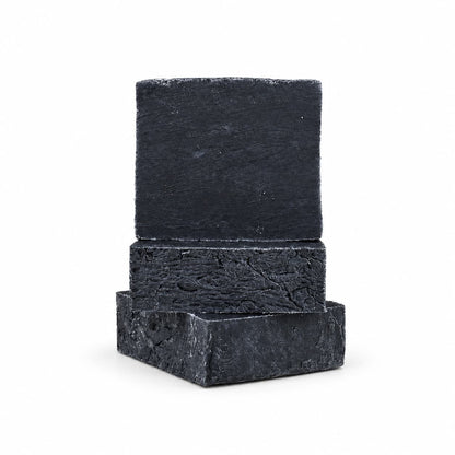 A stack of three rectangular bars of Jarhead Aromatics Charcoal Natural Handmade Soap, an unscented activated charcoal bar soap.