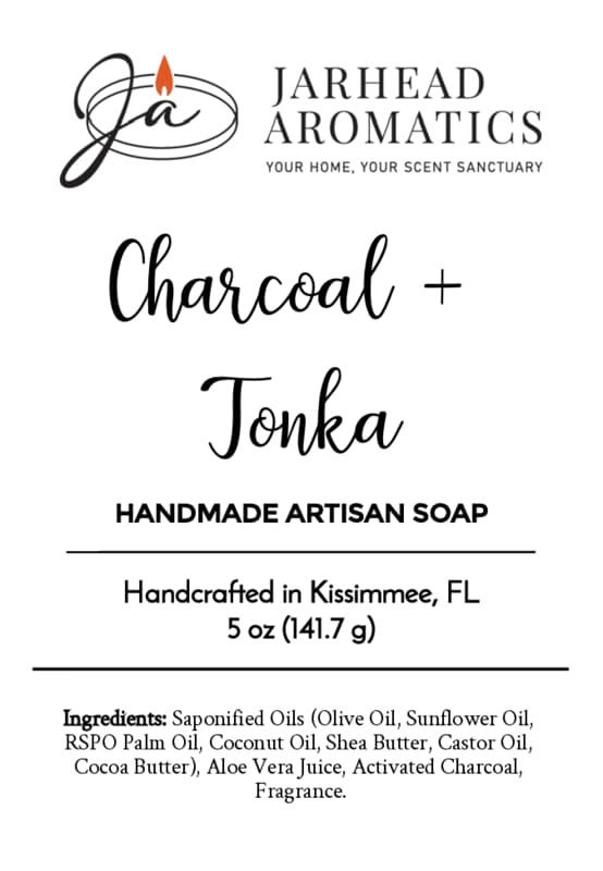 Label for Jarhead Aromatics Charcoal + Tonka Handmade Artisan Soap | Warm Tonka & Activated Charcoal Soap, 5 oz, artisan-crafted in Kissimmee, FL. This bar is handmade and combines activated charcoal for deep cleansing with the warm aroma of tonka. Ingredients and the Jarhead Aromatics logo are displayed in black text on a clean white background.