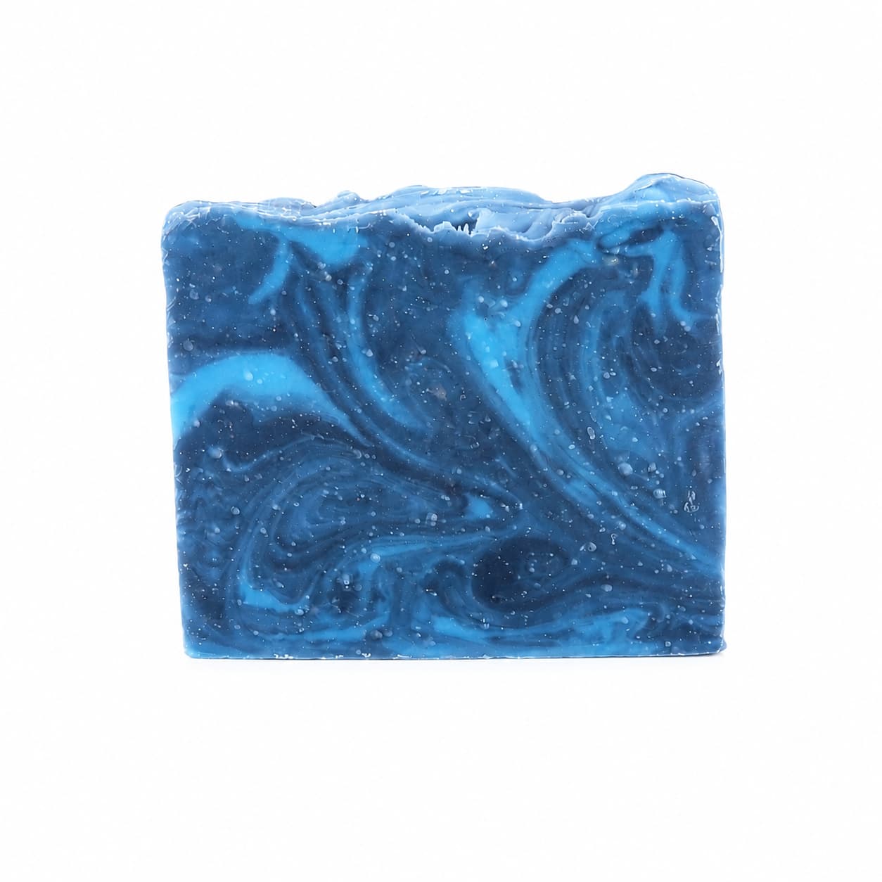 A rectangular bar of Jarhead Aromatics Citron + Cedarwood Handmade Coconut Milk Artisan Soap rests against a plain white background, featuring marbled swirls of light and dark blue. This artisan soap showcases its striking appearance and luxurious feel, delighting the senses with bright citrus and woodsy cedar aromas.