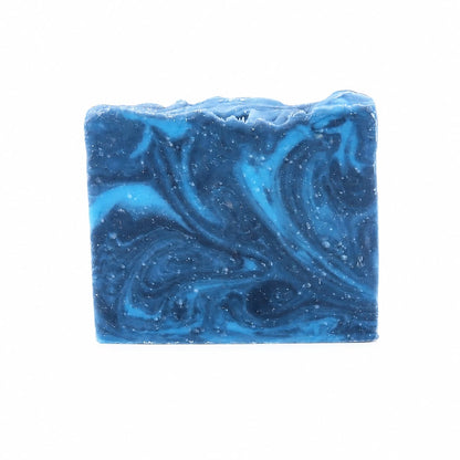 A rectangular bar of Jarhead Aromatics Citron + Cedarwood Handmade Coconut Milk Artisan Soap rests against a plain white background, featuring marbled swirls of light and dark blue. This artisan soap showcases its striking appearance and luxurious feel, delighting the senses with bright citrus and woodsy cedar aromas.
