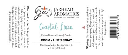 Label for Jarhead Aromatics Coastal Linen Room & Linen Spray | Fresh Linen & Coastal Breeze. Includes directions, ingredients (cotton blossom, linen, powder), a warning, company logo with candle graphic. Refresh your space with this fragrance.