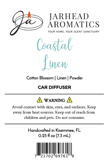 A product label for Jarhead Aromatics Coastal Linen Car Diffuser | Fresh Linen & Ocean Breeze Car Air Freshener, highlighting notes of cotton blossom, fresh linen, and powder. Includes warnings, safety info, manufacturing details, and barcode.