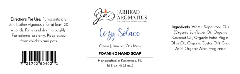 Product label for Cozy Solace Handmade Foaming Hand Soap by Jarhead Aromatics, featuring directions for use, ingredients, a barcode, and a scent profile of greens, jasmine, and oak moss.