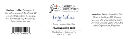 Product label for Cozy Solace Handmade Foaming Hand Soap by Jarhead Aromatics, featuring directions for use, ingredients, a barcode, and a scent profile of greens, jasmine, and oak moss.