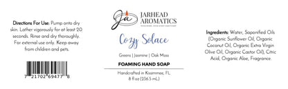 Product label for Cozy Solace Handmade Foaming Hand Soap | Fresh Greens, Jasmine, Oak Moss, listing ingredients, directions, barcode, and botanical fragrance notes of greens, jasmine, and oak moss.
