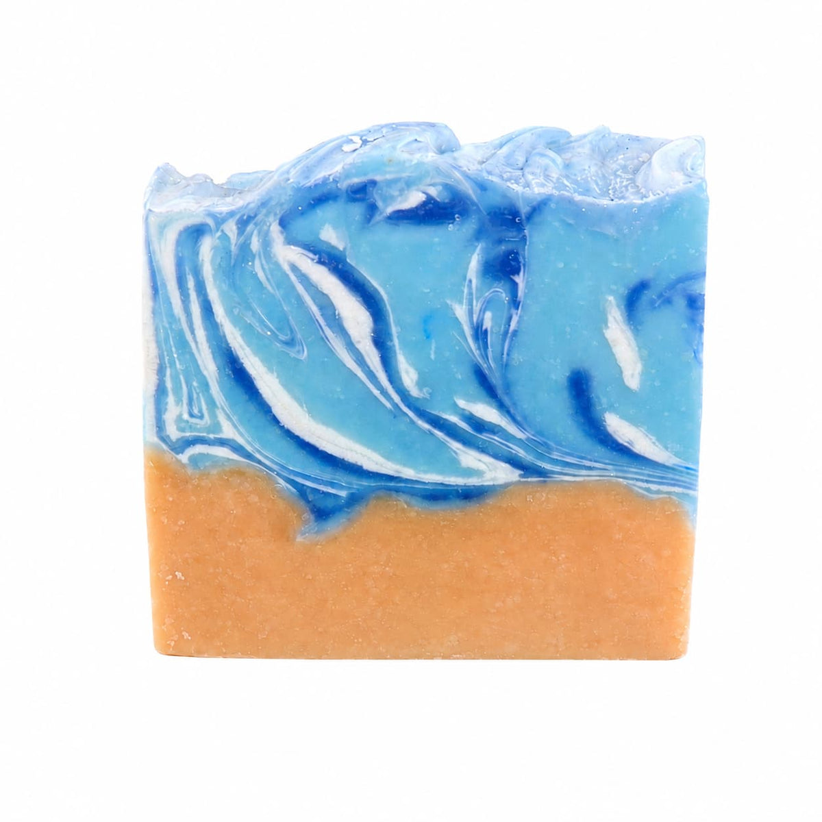 A bar of Driftwood + Sea Salt Handmade Coconut Milk Artisan Soap by Jarhead Aromatics, featuring a marbled blue and white top reminiscent of ocean waves and a vibrant orange base that evokes a coastal beach scene, displayed on a white background.