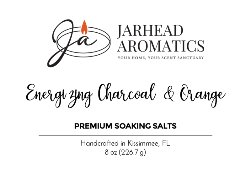 Jarhead Aromatics logo features a stylized Ja and flame icon. Text: Energizing Charcoal & Orange Premium Soaking Bath Salts - All Natural. Highlights Detoxification & Skin Nourishment, handcrafted in Kissimmee, FL, 8 oz (226.7 g).