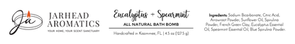A Jarhead Aromatics label for the Eucalyptus + Spearmint Bath Bomb - All Natural, features ingredients, company logo, and slogan Your Home, Your Scent Sanctuary. Net wt: 4.5 oz (127.5 g).