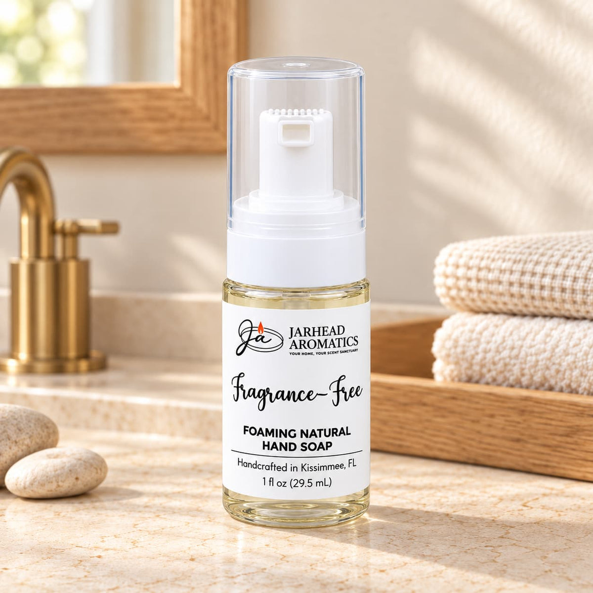 A clear plastic bottle of Jarhead Aromatics Fragrance-Free Handmade Foaming Natural Hand Soap with a white pump dispenser.