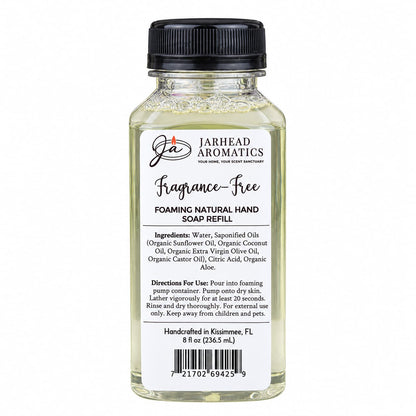 A clear plastic bottle of Jarhead Aromatics Fragrance-Free Handmade Foaming Natural Hand Soap, featuring a black cap and a white label listing ingredients, directions, and a barcode.