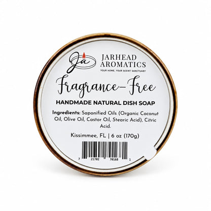 Round container of Fragrance-Free Handmade Natural Solid Dish Soap | Kitchen Cleaning Bar by Jarhead Aromatics, featuring a label with ingredients, weight, and a barcode.