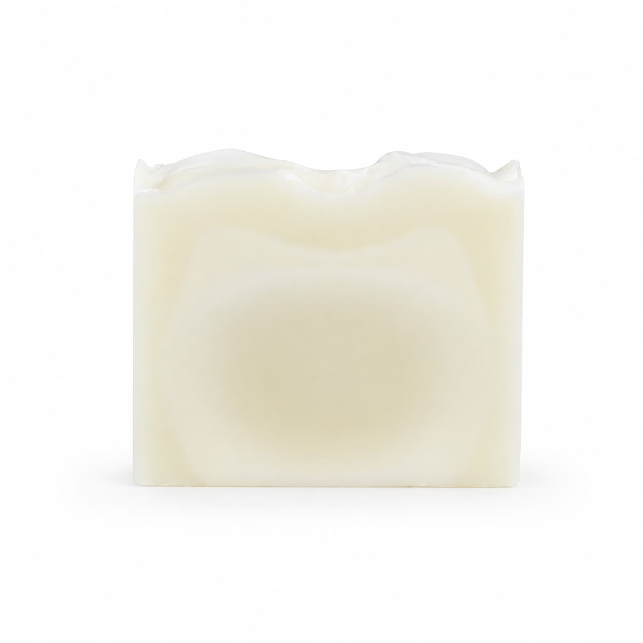 A rectangular, off-white bar of Fragrance-Free Handmade Natural Tallow Artisan Soap by Jarhead Aromatics, featuring a slightly wavy top and photographed against a plain white background.