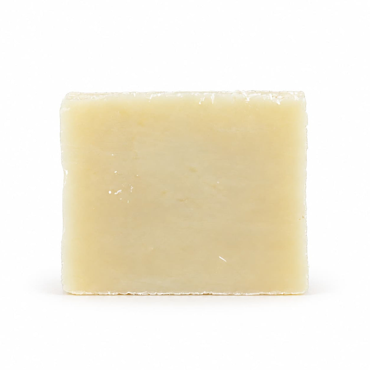 A rectangular bar of Jarhead Aromatics Fragrance-Free Natural Handmade Soap, featuring a cream-colored, unscented shea butter formula.