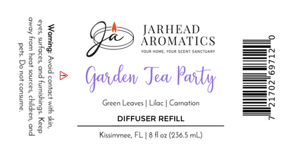 The Jarhead Aromatics Garden Tea Party Diffuser Refill label features a floral scent of rose, jasmine, and vanilla, product size (8 fl oz), warning, barcode, elegant floral script, and Jarhead Aromatics branding.
