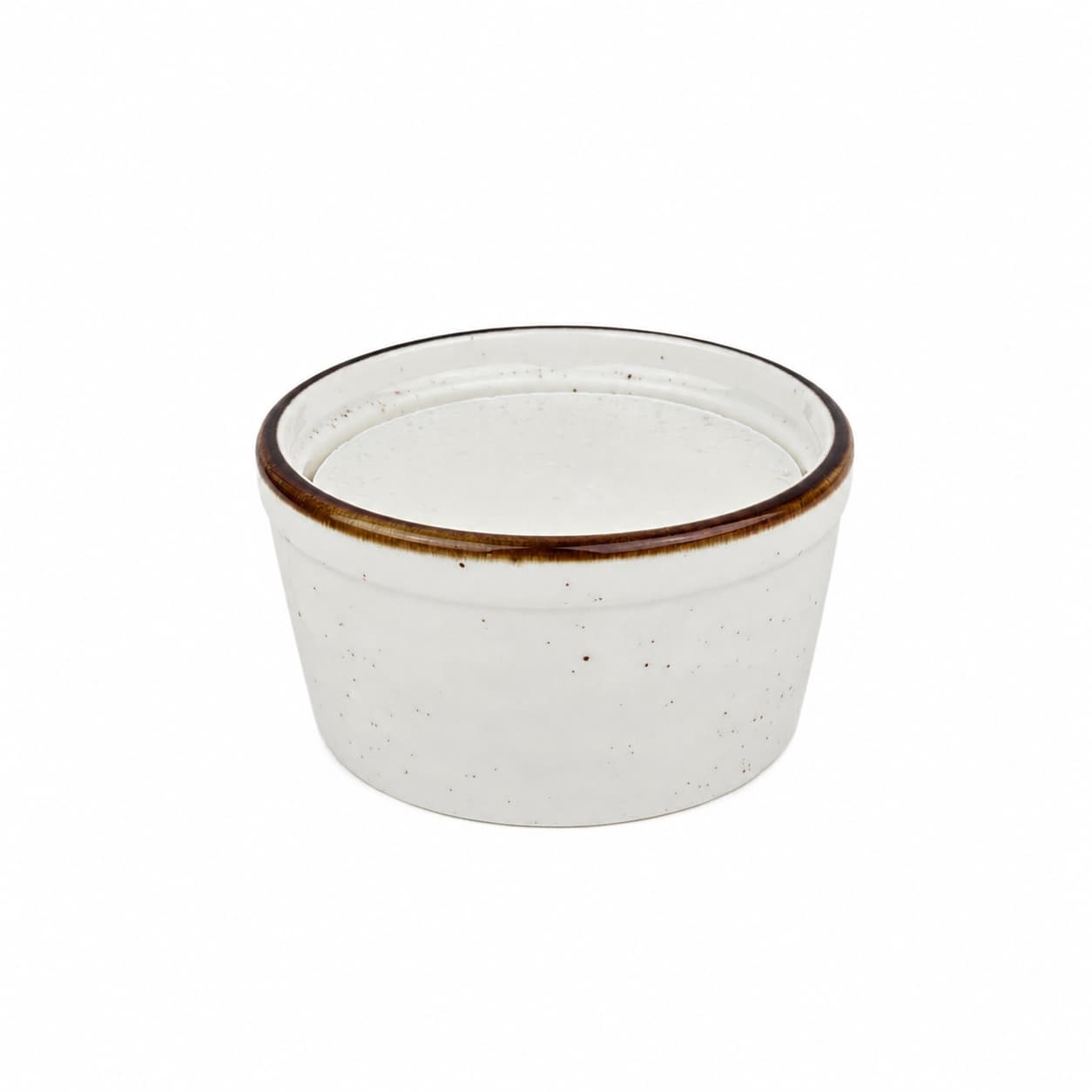 A small white ceramic ramekin with a subtle brown-tinted rim, shown against a plain white background—perfect for displaying Jarhead Aromatics' Lemon Handmade Natural Solid Dish Soap, a citrus kitchen cleaning bar with lemon essential oil.