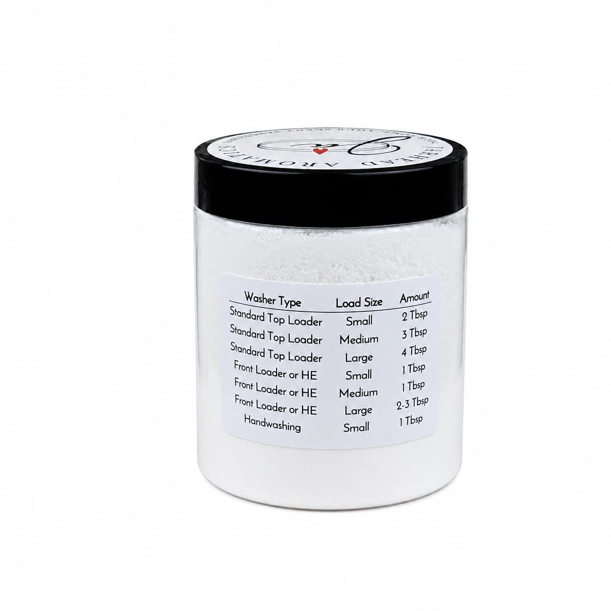 A transparent jar with a black lid contains white powder. The label details detergent instructions for various washer types and load sizes, specifying recommended tablespoon amounts. Jarhead Aromatics’ Fragrance-Free Handmade Natural Laundry Soap is an unscented powdered laundry detergent, carefully formulated to be gentle on both fabrics and skin.