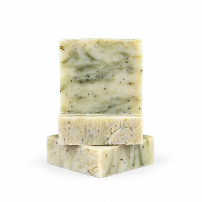 Three stacked bars of speckled, light green Lavender + Eucalyptus Natural Handmade Soap | Exfoliating Poppy Seed Bar Soap by Jarhead Aromatics.